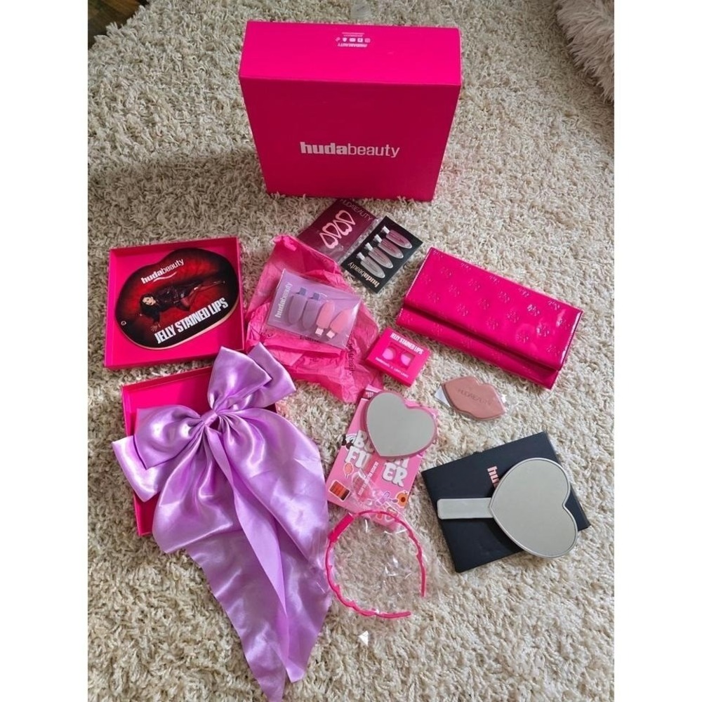 Huda Beauty bundle / PR-style set with box and multiple accessories.